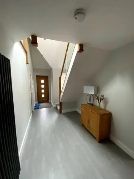 stairs stright up in the hallway of a Bungalow: Swipe To View More Images