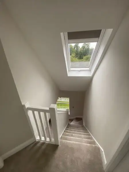 stairs with a window at the landing: Swipe To View More Images