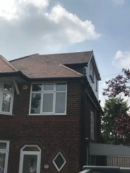 side pitch dormer with flat roof on a side of a property: Swipe To View More Images